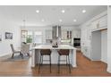 Bright kitchen with a large center island, stainless steel appliances, and breakfast bar seating at 13163 Mcmillan Dr, Orlando, FL 32827