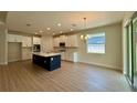 Spacious eat in kitchen with white cabinetry, stainless appliances, and island with sink at 329 Lady Palm St, Apopka, FL 32703