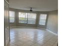 Spacious living room featuring tile floors and lots of natural light from large windows at 2906 Fox Squirrel Dr # 41, Kissimmee, FL 34741