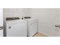 Laundry room with Whirlpool washer and dryer set at 5161 Springrise Dr, Saint Cloud, FL 34772