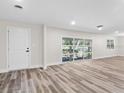 Bright living room featuring beautiful wood floors and large windows for natural light at 1822 Se 8Th St, Ocala, FL 34471