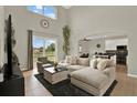 Bright living room with neutral tones, large windows, and a sliding door that provides ample natural light at 2685 Star Grass Cir, Kissimmee, FL 34746