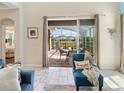 Bright room view featuring patio access and a relaxing outdoor seating area at 8938 Cabot Cliffs Dr, Davenport, FL 33896