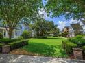 Expansive community green space showcasing well-maintained landscaping and inviting neighborhood ambiance at 2072 Hartz Aly, Orlando, FL 32814