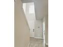 Inviting foyer with soaring ceilings, tile flooring and a modern thermostat at 291 Whistling Duck Trl, St Cloud, FL 34771