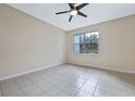 Bright bedroom with tile flooring and ceiling fan at 612 Terrace Spring Dr, Orlando, FL 32828