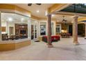 Covered outdoor area featuring a built-in kitchen, ample seating, and views of the pool at 3499 Rockcliff Pl, Longwood, FL 32779