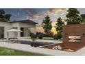 Inviting backyard featuring a modern pool, sunken fire pit, and lounge area with serene sunset views at 110 W Railway Ave, Oakland, FL 34760