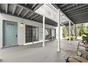 Condo with covered walkways and painted doors in a gated community at 4878 Conway Rd # 91, Orlando, FL 32812