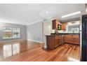 Cozy kitchen featuring stainless steel appliances and wooden floors at 4878 Conway Rd # 91, Orlando, FL 32812
