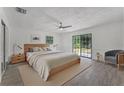 Serene bedroom with natural light and a sliding door, creating a peaceful retreat at 14315 Conifer Dr, Orlando, FL 32832