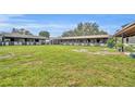 Spacious stables with multiple stalls and a large grassy paddock at 2075 Genova Dr, Oviedo, FL 32765