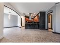 Spacious eat-in kitchen with tile floors, dark backsplash, and stainless steel vent hood at 349 La Creek Ct, Debary, FL 32713