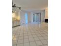 Spacious living room with tile floors and access to patio at 11 Escondido Cir # 105, Altamonte Springs, FL 32701
