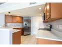 Bright kitchen featuring stainless steel appliances, ample cabinet space, and tile flooring at 337 Goldstone Pl, Lake Mary, FL 32746