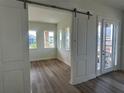 Bright office with wood floors and sliding barn doors at 10257 Medawar St, Orlando, FL 32827