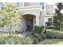 Inviting front entrance with a charming porch and well-maintained landscaping at 1116 Hendon Loop, Davenport, FL 33837