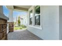 Covered front porch featuring brick pillars and a railing at 5249 Stone Ridge Pl, St Cloud, FL 34771
