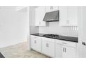 Bright kitchen featuring white cabinetry, stainless steel appliances, and sleek countertops at 5249 Stone Ridge Pl, St Cloud, FL 34771