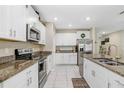 Modern kitchen with granite countertops and stainless steel appliances at 1536 Landmark Dr, Lakeland, FL 33801