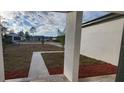 View of backyard from covered porch at 1109 East Pkwy, Deland, FL 32724