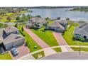 Luxury homes with brick driveways and lush landscaping at 13016 Shady Retreat Loop, Clermont, FL 34711