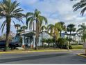 Exterior view of Millennium Palms Condominiums buildings surrounded by palm trees at 4743 S Texas Ave # 4743B, Orlando, FL 32839