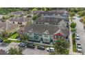 An aerial view showing colorful townhomes with neatly landscaped surroundings, easy parking and community appeal at 1349 Mill Stream Ln, Winter Springs, FL 32708