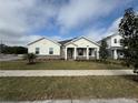 Inviting single-story home with a well-manicured lawn and charming exterior details at 2564 Hawks Overlook Pl, Oviedo, FL 32765