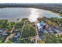 Aerial view of a lakefront property showing the surrounding area, water access, and proximity to a large lake at 1322 Susannah Blvd, Orlando, FL 32803