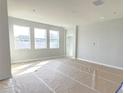 Bright living room with three large windows at 2619 Great Heron Ave, Saint Cloud, FL 34771