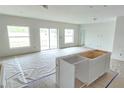 Bright and airy living room with sliding glass doors at 2637 Great Heron Ave, Saint Cloud, FL 34771