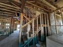 Interior view showcasing the wooden frame under construction featuring a staircase at 2684 Great Heron Ave, Saint Cloud, FL 34773