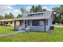 Charming bungalow-style home with a covered porch and freshly painted exterior at 500 N 13Th St, Leesburg, FL 34748