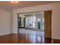 Bright living room with hardwood floors and access to a sunroom at 4423 Real Ct, Orlando, FL 32808