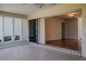 Sunroom with tiled floor, sliding glass doors, and multiple windows at 4423 Real Ct, Orlando, FL 32808