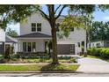 Charming two-story home with a modern front yard landscape and a convenient two-car carport at 1020 W Princeton St, Orlando, FL 32804