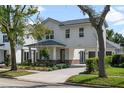 Charming two-story home with landscaped yard, portico, and driveway at 1020 W Princeton St, Orlando, FL 32804