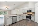 Modern kitchen features stainless steel appliances, sleek countertops, and ample cabinet space at 1928 Michigan Ct, Kissimmee, FL 34759