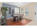 The dining room offers hardwood floors, natural light and elegant decor at 226 W Tarrington Dr, Deland, FL 32724