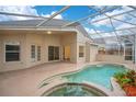 Relaxing backyard oasis featuring a pool and screened-in patio at 623 Buckingham Dr, Oviedo, FL 32765