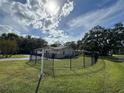 Single-story home with a fenced yard and mature trees at 1501 Noble St, Longwood, FL 32750