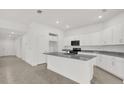 Bright kitchen features white cabinetry, stainless steel appliances, and granite countertops at 2676 Hancock Crossing Dr, Bartow, FL 33830