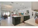 Modern kitchen featuring a large island, stainless steel appliances, and an open layout at 1162 Alder Tree Dr, Apopka, FL 32703