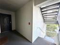 View of the stairwell near the front door of the condo at 13803 Fairway Island Dr # 1627, Orlando, FL 32837