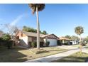 Charming single-Gathering home with a well-manicured lawn and attached two-car garage at 666 Sausalito Blvd, Casselberry, FL 32707