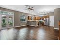 Kitchen and dining room featuring stainless steel appliances, custom cabinets, and hardwood floors at 41 E Spruce St, Orlando, FL 32804