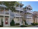 Three-story building with multiple units, balconies, and white columns at 535 Crimson Ln, Winter Springs, FL 32708