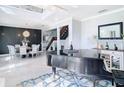 Open-concept living and dining area featuring elegant decor and a grand piano at 10542 Wittenberg Way, Orlando, FL 32832