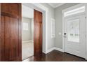 Warm entryway boasting hardwood floors, a stylish door, and built-in shelving at 1338 Union Club Dr, Winter Garden, FL 34787